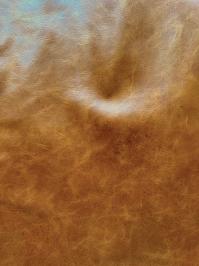 Tan Distressed Upholstery Cowhide close view showing grain and texture