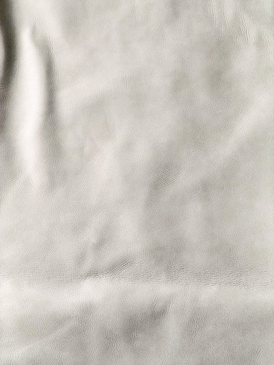 White Antique Distressed Upholstery Cowhide shown in a full product view