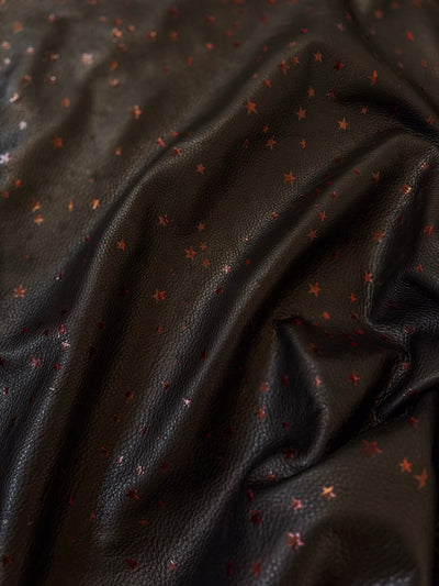 Close view of Black and Red Star Natural Grain Chrome-Tanned Cowhide with Italian foil finish