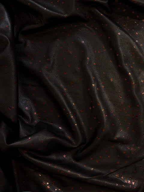 Black and red star Natural Grain Chrome-Tanned Cowhide draped to show its soft hand and pebble grain