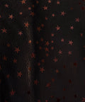 Texture detail of the red star Italian foil finish on black Natural Grain Chrome-Tanned Cowhide