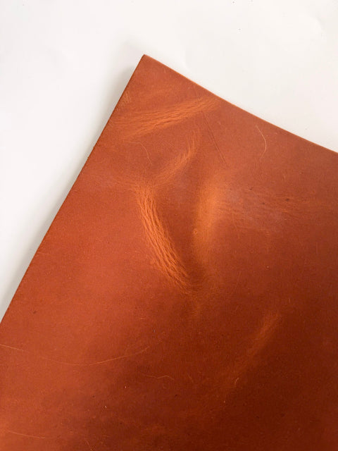 Tan Crazy Horse cowhide 12 x 24 leather sheet showing the wax and oil pull-up effect