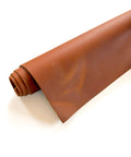 Rolled tan Crazy Horse cowhide pre-cut leather sheet measuring 12 x 24 inches