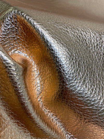 Close-up of Metallic natural-grain cowhide showing grain, texture, and finish